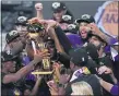  ?? MARK J. TERRILL— THE ASSOCIATED PRESS ?? The Los Angeles Lakers celebrate after the Lakers defeated theMiami Heat in Game 6of the NBA Finals Sunday in Lake Buena Vista, Fla.