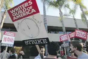  ?? THE ASSOCIATED PRESS ?? Members of the Writers Guild of America (here at NBC Studios in Burbank, Calif.) went on strike for 100 days in 2007-08.