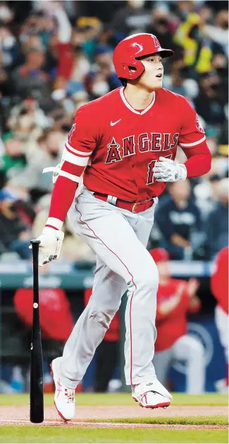  ?? — Pictures/AFP ?? Shohei Ohtani of the Los Angeles Angels watches his home run against the Seattle Mariners during the first inning at T-Mobile Park in Seattle, Washington.