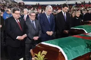  ?? PAUL CHIASSON, THE CANADIAN PRESS ?? Prime Minister Justin Trudeau (right to left) Quebec Premier Philippe Couillard, Quebec City Mayor Regis Labeaume and Montreal Mayor Denis Coderre pay their respects by the caskets of three of the six victims.