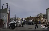  ?? JEFF CHIU — THE ASSOCIATED PRESS FILE ?? People walk inside a recycling location in Oakland.