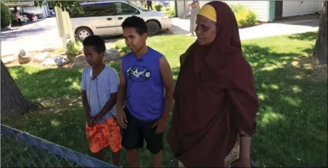  ??  ?? Fathi Mahamoud, 11 (left) Esrom Habte, 12 (center) and Thado Aip describe the Saturday night attack that left nine fellow residents of their Boise, Idaho, apartment complex with stabbing injuries, on Sunday. Police have arrested a suspect in the case....