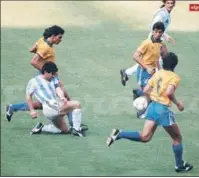  ?? ?? Diego Maradona makes his brilliant pass to Claudio Caniggia (running above) for the goal to Brazil at the World Cup.