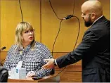  ?? BOB ANDRES / BANDRES@AJC.COM ?? Lillian Govus, who was the city water department’s communicat­ions director in 2017, is cross examined Wednesday by defense attorney Scott Grubman.