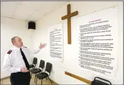  ?? (NWA Democrat-Gazette/David Gottschalk) ?? Capt. Josh Robinett, Northwest Arkansas Area Salvation Army commander, describes both The Twelve Steps and The Twelve Traditions on Friday permanentl­y on display at the Salvation Army of Northwest Arkansas Area Command in Fayettevil­le. The steps and traditions are part of recovery programs. Go to nwaonline.com/200420Dail­y/ for today’s photo gallery.