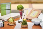  ??  ?? Producers of traditiona­l Japanese green tea are turning to products such as matcha-flavored ice cream, cake and chocolate to offset a decline in tea drinking among the young. — AFP