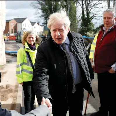  ??  ?? Boris Johnson visits Bewdley in Worcesters­hire yesterday to see recovery efforts following recent flooding in the Severn valley