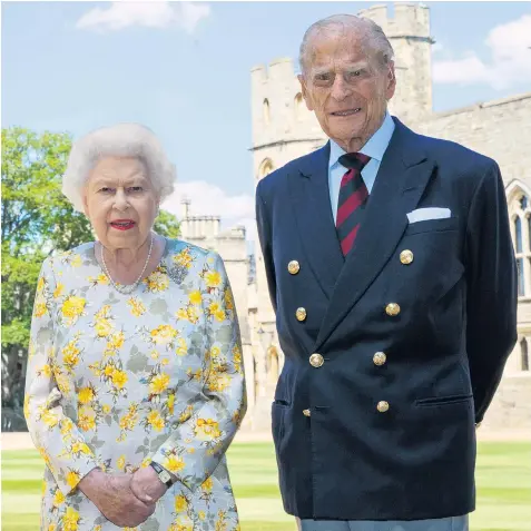  ??  ?? Her Majesty the Queen and the Duke of Edinburgh, who have been married for 72 years, pose for his official birthday photograph in the sunlit grounds of Windsor Castle