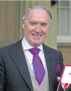  ??  ?? HONOURED: Sir David receiving his knighthood in 2000.