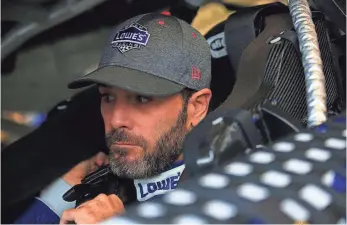  ?? CHRIS TROTMAN, GETTY IMAGES ?? Jimmie Johnson survived hitting the wall twice Sunday to advance in the playoffs as he pursues a record eighth Cup series championsh­ip.