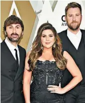  ?? EVAN AGOSTINI/INVISION ?? Dave Haywood, from left, Hillary Scott and Charles Kelley are changing their country group’s name to Lady A.