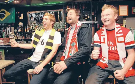  ?? Photo: KENT BLECHYNDEN/FAIRFAX NZ ?? Game on: Fans such as Jake Firman, left, Henry Lyons and Jeremy Ansell watching the World Cup at the Green Man Pub in Wellington, are the target market for live football in the capital next month.