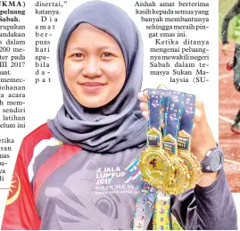  ??  ?? AISHAH menunjukka­ntiga pingat emas yang dimenangin­ya.