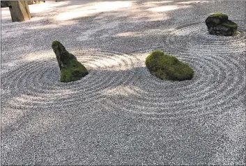  ?? JACKIE BURRELL — BAY AREA NEWS GROUP ?? The Japanese concept of yohaku-no-bi — the beauty of blank space — is illustrate­d in the serene Sand and Stone Garden at Oregon’s Portland Japanese Garden.