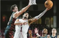  ?? CHARLES KRUPA/AP ?? Boston College forward T.J. Bickerstaf­f puts up a shot past Clemson center PJ Hall during Tuesday night’s game in Boston.