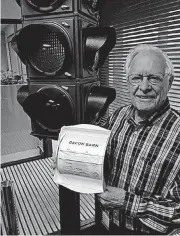  ?? [PHOTO BY PAULA BURKES, THE OKLAHOMAN] ?? Phil Parduhn, traffic signal manufactur­er and soon-tobe Oklahoma Hall of Fame inductee, displays his “Bacon Barn.”