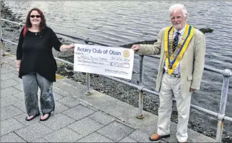  ??  ?? North Argyll Carers Centre manager Judith Hawcroft recently received a cheque for £4,000 from Oban Rotary Club President Douglas Small to support its work with young carers.