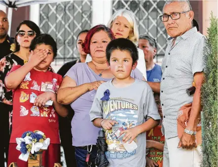  ?? Elizabeth Conley / Houston Chronicle ?? Relatives of Josue Flores listen to speakers during an event marking the second anniversar­y of his killing. Residents, community organizers, lawmakers and police continue to seek informatio­n that might solve the 11-year-old’s slaying.