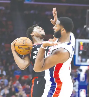  ?? ASSOCIATED PRESS ?? Toronto Raptors guard Kyle Lowry is fouled by Detroit Pistons center Andre Drummond, right, during the second half of an NBA basketball game in Detroit.