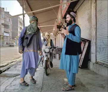  ?? Mohammad Asif Khan Associated Press ?? TALIBAN fighters patrol in Farah after seizing the provincial capital on Wednesday. The insurgents’ lightning takeover of swaths of Afghanista­n leaves observers wondering whether Afghan forces can turn the tide.