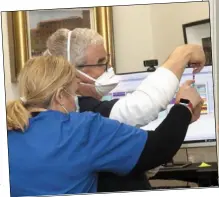  ??  ?? LEFT: Dr David Curtis and Dorothy Patel get the injection ready.