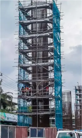  ??  ?? NEW LRT post rises in North Ave., Quezon City as government is in overdrive to support its “Build, Build, Build” infrastruc­ture projects.