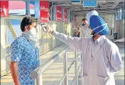  ?? HT FILE ?? Passengers undergoing thermal scanning on their arrival at railway station in Amritsar.