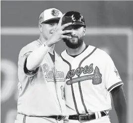  ?? ROB CARR/GETTY IMAGES ?? Orioles shortstop Manny Machado takes a selfie with former teammate Nick Markakis, now with the Braves. Markakis was making his first All-Star Game appearance.