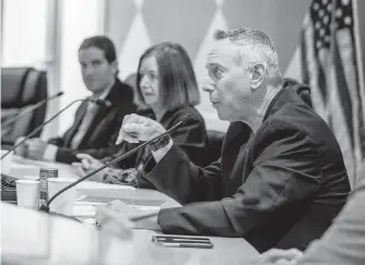  ?? PEDRO PORTAL/PPORTAL@MIAMIHERAL­D.COM ?? (From left to right) Surfside Mayor Shlomo Danzinger and commission­ers Marianne Meischeid and Fred Landsman during a commission meeting on March 29, 2022.