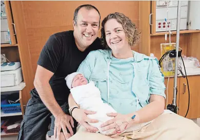  ?? BOB TYMCZYSZYN TORSTAR ?? Married paramedics Mark and Taylor Haynes welcomed son Weston after an unexpected delivery at one of the Niagara Emergency Medical Services stations.