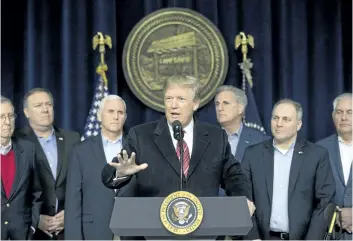  ?? ANDREW HARNIK/AP PHOTO ?? U.S. President Donald Trump, centre, accompanie­d by from left, Senate Majority Leader Mitch McConnell of Ky., VicePresid­ent Mike Pence, House Majority Leader Kevin McCarthy of Calif., House Majority Whip Steve Scalise, R-La., Secretary of State Rex...