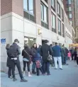  ?? BRYAN R. SMITH, AFP/GETTY IMAGES ?? People stand in line outside a polling station at Trump Place on Election Day this month in New York.