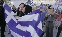  ?? PETROS GIANNAKOUR­IS/ASSOCIATED PRESS ?? Suppor ters of the “no” vote celebrate Sunday at Syntagma Square in Athens, Greece, af ter Greeks rejected demands for more austerit y measures.