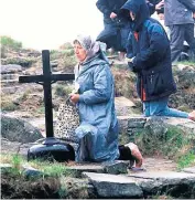  ??  ?? Religious experience: Lough Derg pilgrims