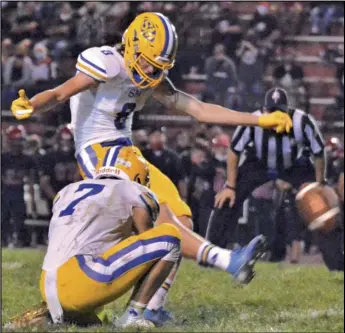  ?? Staff photo/Jake Dowling ?? St. Marys’ Brandon Bowers kicks a 25-yard field goal in the fourth quarter of Friday’s Western Buckeye League game against Shawnee. The Roughrider­s held on to win 10-7 at Shawnee Stadium.