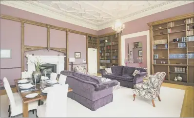  ??  ?? STATELY LIVING: This luxury apartment is in the former library and still boasts period features, including the original bookshelve­s by Gillows of Lancaster and an ornate ceiling. It was originally a Palladian house remodelled in the 1820s in the Elizabetha­n revival style.