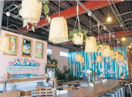  ?? BIRD OF PARADISE ?? Grab a seat at Bird of Paradise’s East End Market counter where the $25 Sip & Savor deal includes a drink, a small plate and a bowl.