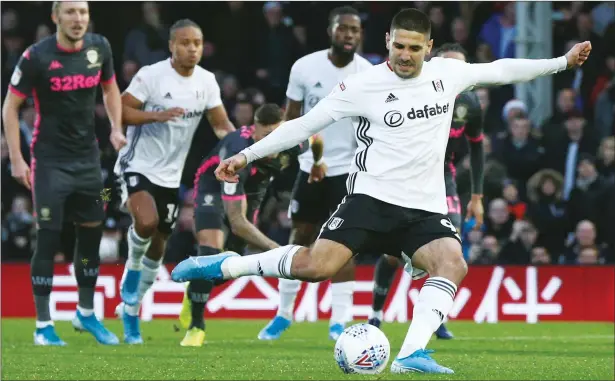  ?? PICTURE: PA Images ?? MR COOL: Aleksandar Mitrovic scores Fulham’s first goal from the penalty spot