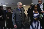  ?? SUSAN WALSH — THE ASSOCIATED PRESS ?? Senate Majority Leader Mitch McConnell of Kentucky is followed by reporters and staff as he leaves a meeting on Capitol Hill in Washington on Friday.