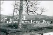 ?? SUBMITTED PHOTO ?? The terraced stone Hoch graveyard with once wood coping, though no longer, to protect the stone wall from the elements. Typically, Pa. Dutch farmsteads featured coped garden walls, terraces, and a barnyard to complement the huge Swiss-bank barn and...