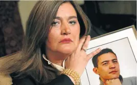  ?? Picture: © PETER PAYNE/ THE DAILY TELEGRAPH ?? FIGHT FOR JUSTICE: Susan Sutovic with a picture of her son, Petar