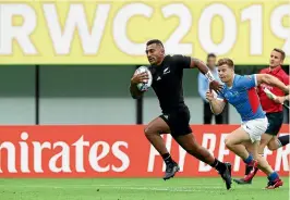  ?? GETTY IMAGES ?? Sevu Reece races away to score against Italy in a World Cup game earlier this month to continue a wildly successful year for the All Blacks wing.