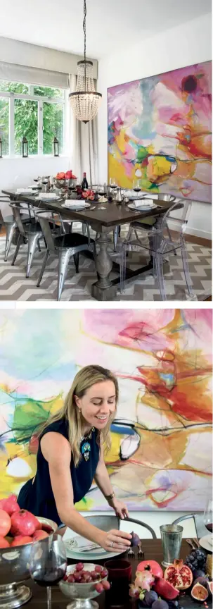  ??  ?? from TOP An abstract painting adds bright bursts of colour to the indoor dining space; Victoria placing final touches on the table setting
OPPOSITE
Little Birds by Sallyann Johns hangs above an antique oriental cabinet that doubles as a bar