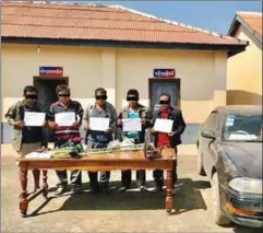  ?? NATIONAL POLICE ?? The accused were caught red-handed while they dug for artefacts near a temple in Choam Ksan district.