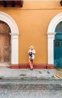  ??  ?? 1 Exploring the colorful streets of Cartagena.
2 A photo with Cartagena's iconic Palenquera­s 3 World-renowned Colombian fashion designer Johanna Ortiz Cartagena boutique
1