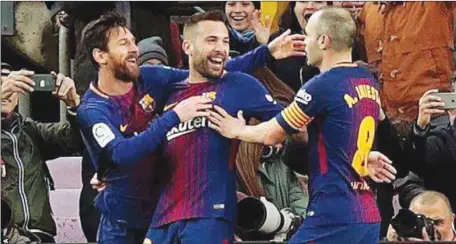  ??  ?? L-R: Messi, Jordi Alba and Andrea Iniesta celebratin­g Barcelona’s victory over Levante… yesterday