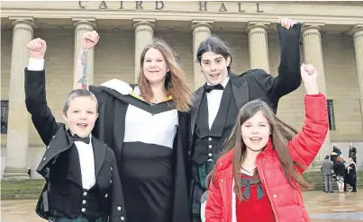  ??  ?? From left: Daniel, 9, Claire, Steven and Alanis Campbell, 10, from Lochee, Dundee, outside the Caird Hall. Claire graduated in Neuroscien­ce.