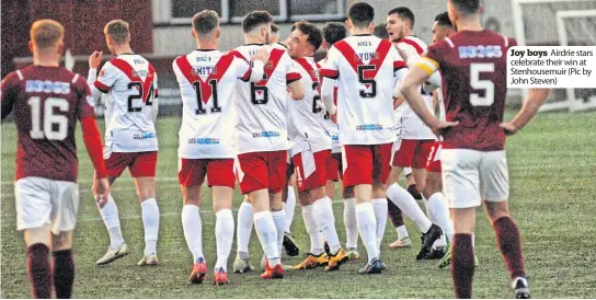  ?? ?? Joy boys Airdrie stars celebrate their win at Stenhousem­uir (Pic by John Steven)