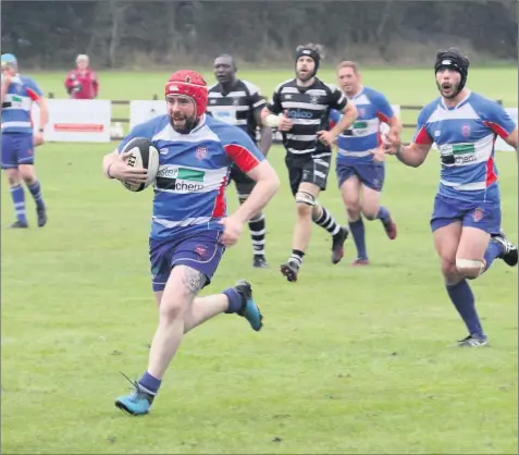  ??  ?? Leek Rugby Club’s Joe Cooper intercepte­d on his own 10 metre line and sprinted for the left corner for Leek’s bonus point try.