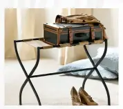  ??  ?? Keep luggage off the guest room floor with a luggage rack. Light and easy to store, this Gaspar rack is from Ballard Designs and many homeowners use a couple of these at the foot of their bed for pillows.